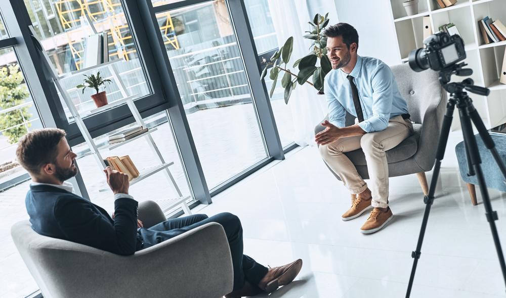 Two men sitting opposite each other in a recruiting interview